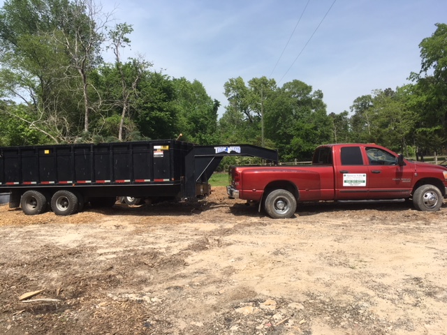 Ignacio Villa's Tree Service company truck with tree trimming, pruning, and removal signage in Huntsville, TX